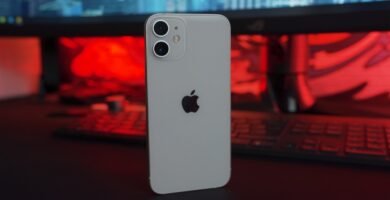 white iphone 5 c on table